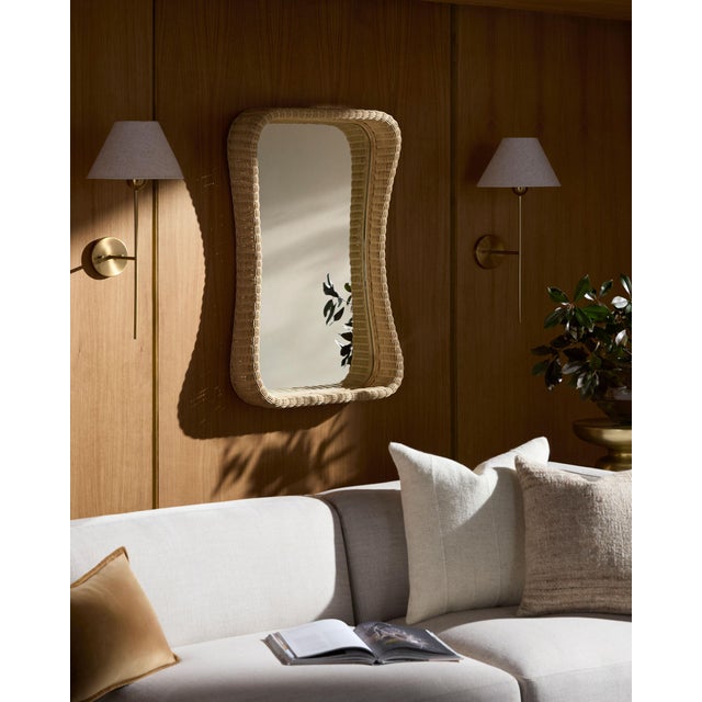Elevate your living space with the Currington accent mirror, a captivating piece of wall decor that embodies the free-...