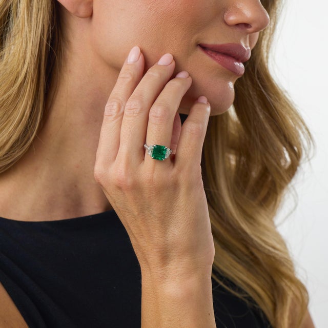 This extraordinary contemporary Lugano ring is centered by an AGL-certified emerald cut Colombian emerald weighing 3.41...