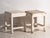 A pair of antique bedside tables in pine wood, with a square top and four tapered legs tied by box stretchers. They...