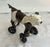 Charming British ceramic black and white dog on wheels. The saddle lifts exposing a trinket space. Very cute and unique...