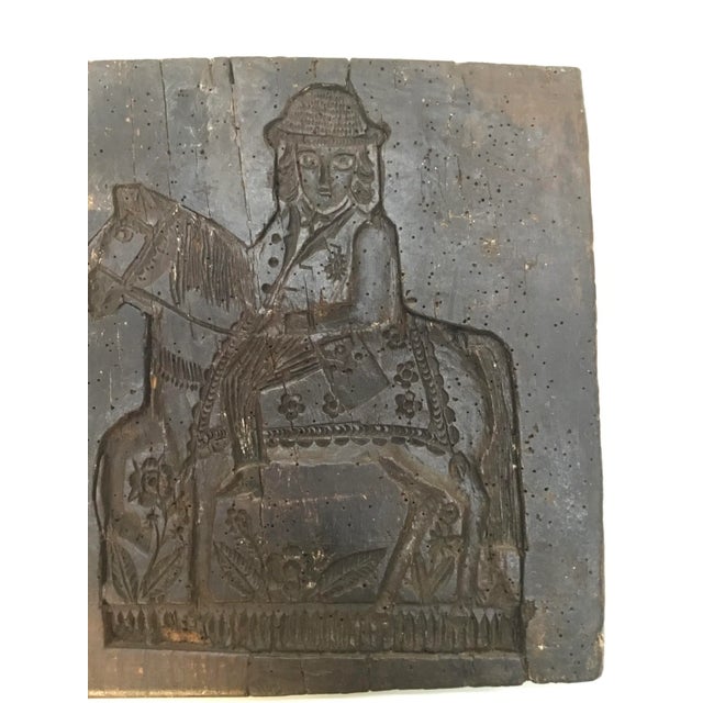 Charming antique carving depicting man on the horse among flowers . cracks, wormholes and very old repairs only adding to...