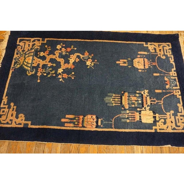 This early 20th-century calming antique Chinese rug is a jewel-like example of the "East-meets-West" aesthetic that...
