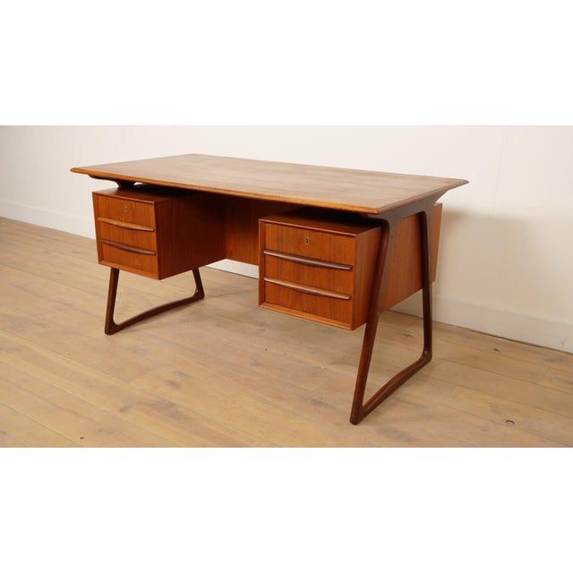 What a picture this is! This beautiful vintage desk was designed by Svend Aage Madsen in Denmark. The desk stands out for...