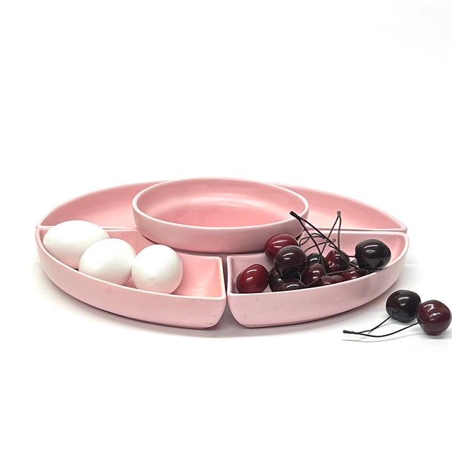 Pink ceramic serving dishes, set of 5. This mid-century statement piece is a set of blush pink serving dishes. Together,...