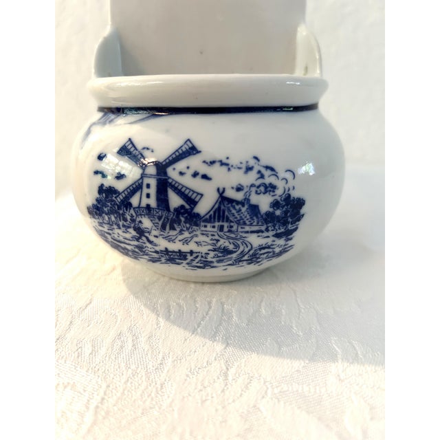 Charming vintage blue and white ceramic hanging wall pocket (believe it was originally a salt box as there looks like...