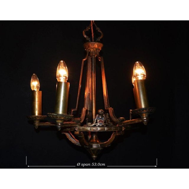 An impressive french five-light chandelier dating to the 1920s, beautifully constructed in bronze and gilt bronze with...
