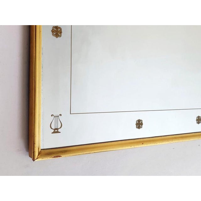 An extaordinary large full lenght wall mirror from the 1950's with a neoclassic design in the manner of Gio Ponti. The...