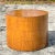 A stunning vintage Boho side table. A chic drum shape with beautiful wood grain detail. Three grouted bands along the...