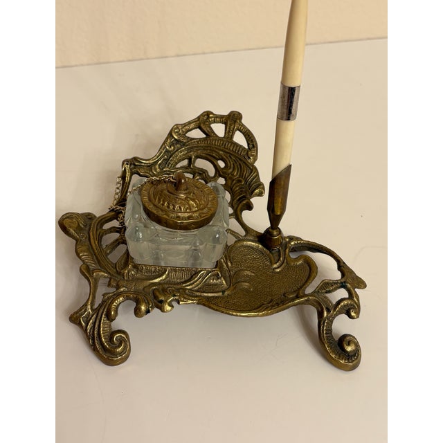 Victorian-style or Art Nouveau brass inkwell stand and pen holder (featured with a pen, however it is sold without one)....