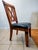 These four chairs are crafted from solid pine wood and decorated with leather strips. They are upholstered in fine black...