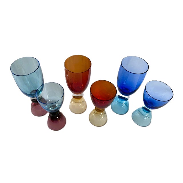 Elevate your table with this exceptional set of hand-blown Murano crystal glasses, personally signed by the celebrated...