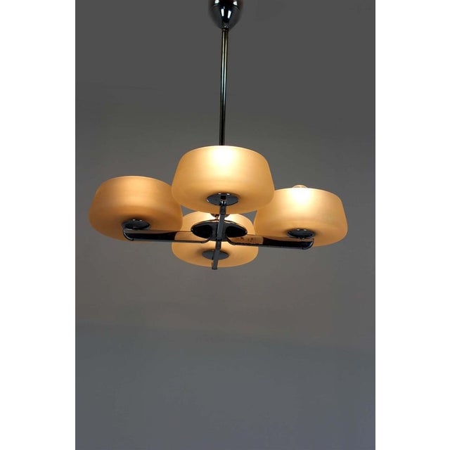 A striking four-arm chandelier designed and manufactured by esc in former czechoslovakia, most likely dating from the...