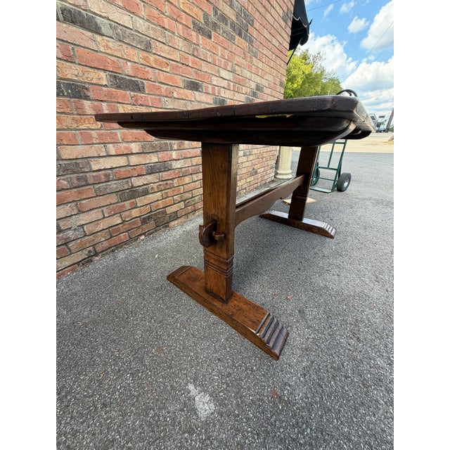 This 19th-century French Trestle Table exudes timeless charm with its sturdy wooden construction and rustic allure....