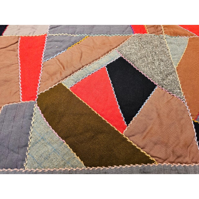 77.5” x 77.5” Hand pieced and embroidered African American crazy quilt circa the early 1900s. The quilt contains 25 blocks...