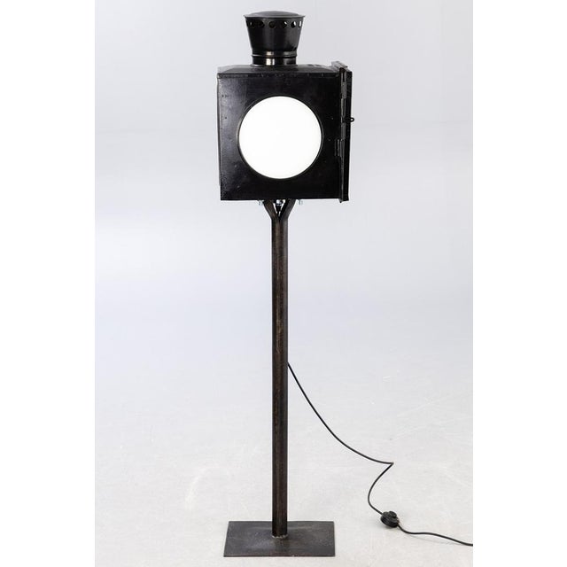 steel, painted black. White glass H. ca. 142 cm. European Plug (up to 250V).The wiring of this item may be original and...