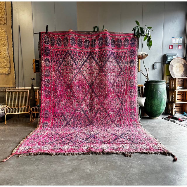 Bring a piece of authentic Moroccan craftsmanship into your home with this pink stunning vintage Boujad wool rug....