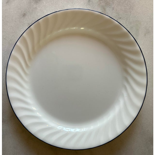 Set of 6 vintage Corelle Enhancements glass dinner plates by Corning in a glossy white swirl with a cobalt blue trim....