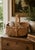 A beautifully woven early 20th century American splint oak basket with warm honeyed tones and a tightly constructed...