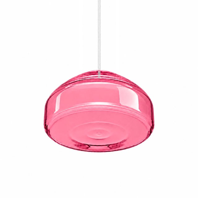 Crafted with high visual clarity, this modern pendant lamp features a sleek silhouette hand-blown from premium glass in a...
