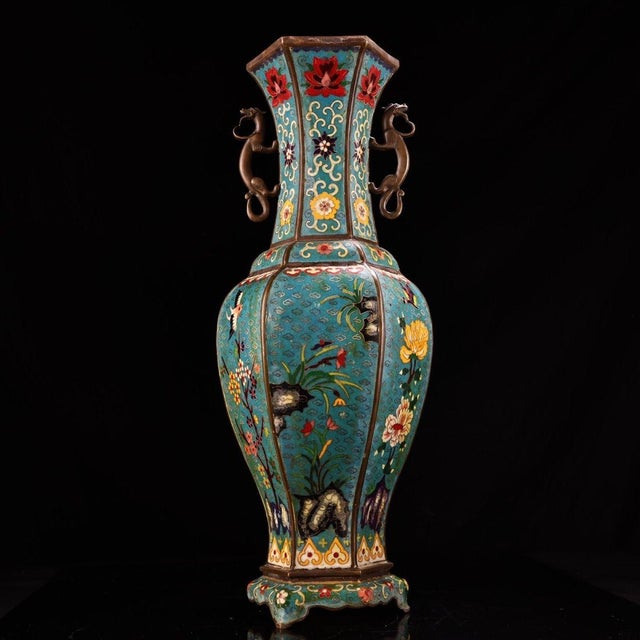 This is a large, cast bronze cloisonné enamel vase of hexagonal form, featuring intricate wire inlay and vibrant...