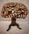 Antique Victorian (1837-1901) adjustable piano stool with a carved wooden and cast iron pedestal, claw feet and a tripod...
