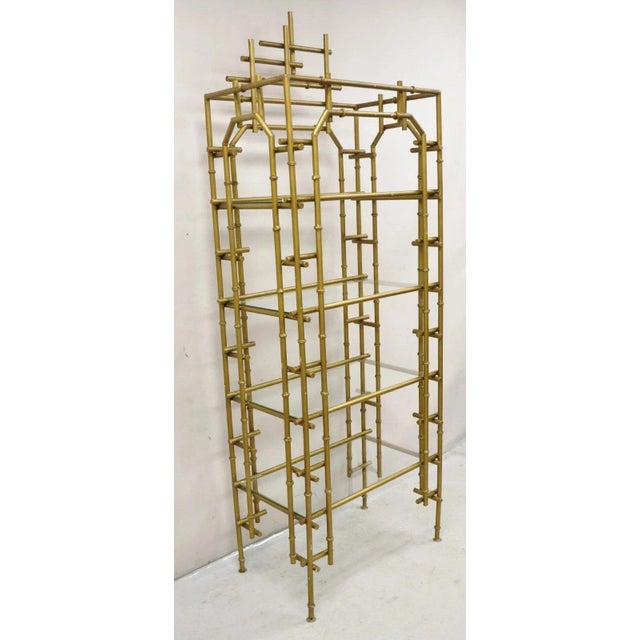 Vintage Hollywood Regency Faux Bamboo Chinese Chippendale Pagoda Gold Gilt Etagere Bookcase with 4 Glass Shelves. Circa...