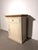 Elegant compact storage cabinet crafted in oak, combining a warm natural wood top with a soft cream-painted body. The...