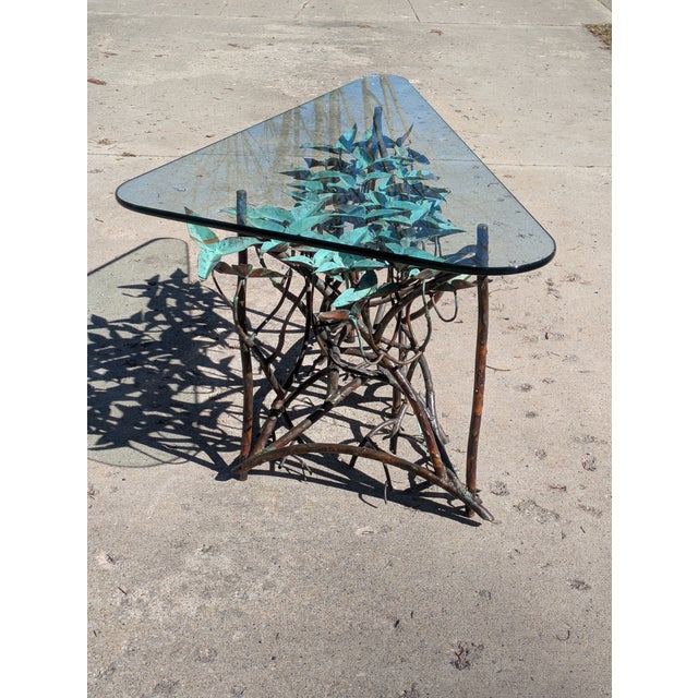 This stunning copper hand made table is signed "Nelson." The table features a verdigis patinated copper leaf top and warm...