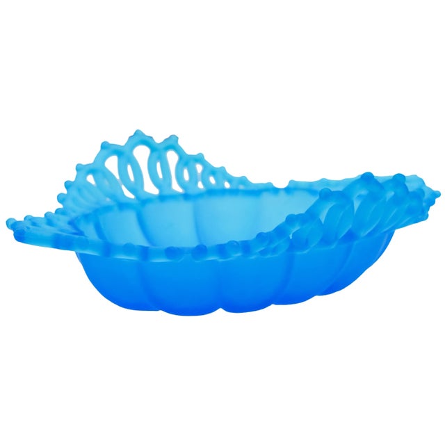 Blue glass dish with intricate glass-cut pattern and ornate details. No Maker's mark. This beautiful accent ships within...