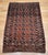 This beautifully preserved early 20th century Turkmen Tekke area rug features the classic allover small gul medallion...