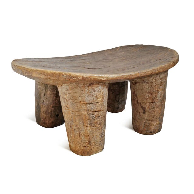 Vintage larger sized Lobi wood stool. Beautiful thick carved legs created from a single piece of wood. Apparent signs of...