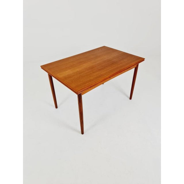 Danish rectangular teak dining table with two extension leaves. By N&R Möbler, Denmark, 1960s. The table is in very good...