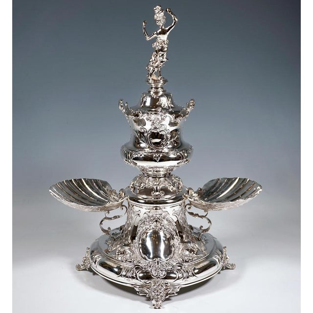 Excellent original viennese art nouveau centerpiece around 1900: a wide, round, trumpet-shaped silver pedestal, curved at...