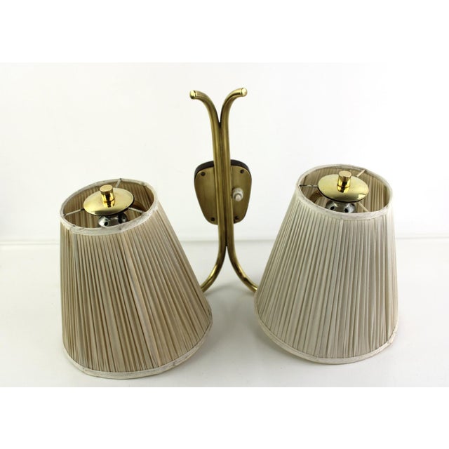 original fabric shades, 2 E27 sockets This piece is attributed to the mentioned designer/maker. It has no attribution mark...