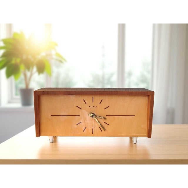 This original table clock by weimar electronic was made in the 1960s in the former gdr and embodies the clean lines of...