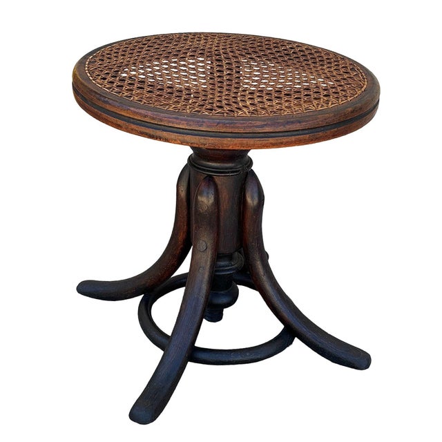 Late Victorian bent oak & cane Thonet Piano Stool No. 1 Featuring an elegant, fluidly splayed legs joined by a circular...