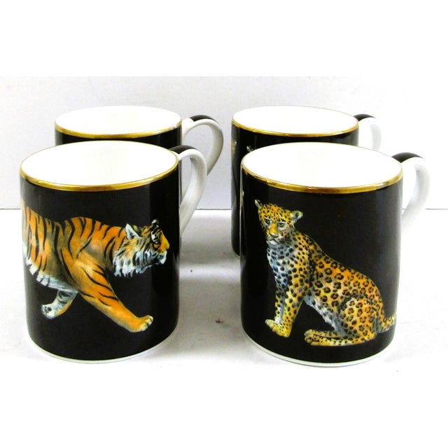 The is a set of four Halcyon Days magnificent wildlife mugs, featuring a round shape and a multicolor wildlife pattern....