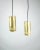 The brass ceiling lamp, characterized by a characteristic cylinder shape and a black cord, is a remarkable example of...