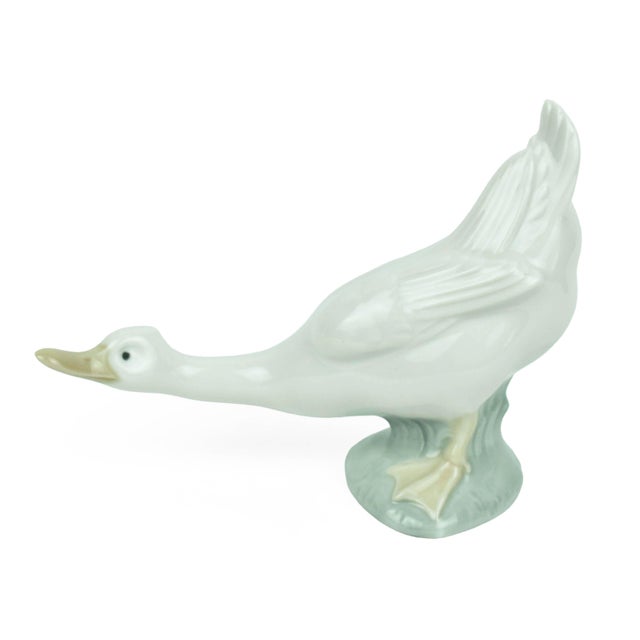 Bring a touch of serene, pastoral charm to your shelving or mantel with this delightful pair of vintage porcelain...
