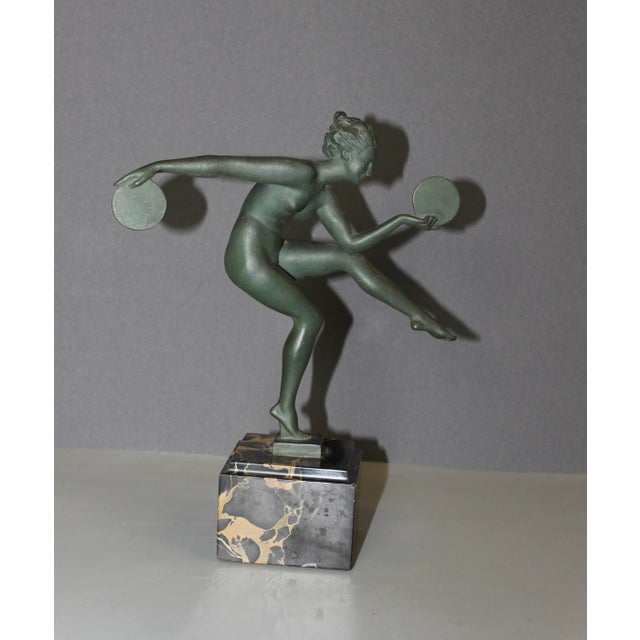 Cast iron pagan dancer (high tin content spelter) with original green patina, dancer with discs, Portoro marble base,...