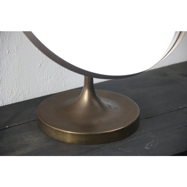 This Swedish bronze table mirror is reminiscent of designs by Josef Frank for Svensk Tenn.