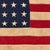 This vintage American flag is made from a thin cotton cloth with fully sewn stars and stripes. Please note overall...