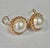 14K Yellow Gold Vintage Mabe Pearl Earrings. Earrings each feature a Mabe pearl framed by a delicate scalloped bezel,...