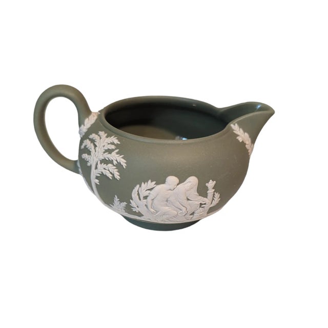 This jasperware Creamer appears to have been made in 1930. It is glazed on the inside, to prevent staining, and will hold...