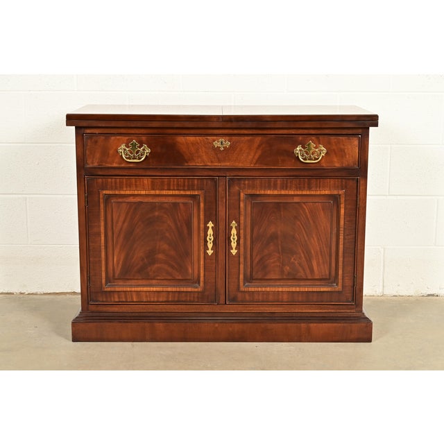 A beautiful Georgian or Chippendale style flip top buffet server or bar cabinet By Drexel Heritage USA, Circa 1980s...