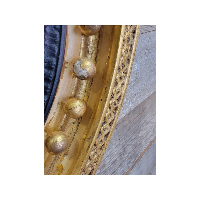 A Carved and Gilded English Regency Convex Mirror For Sale - Image 4 of 13