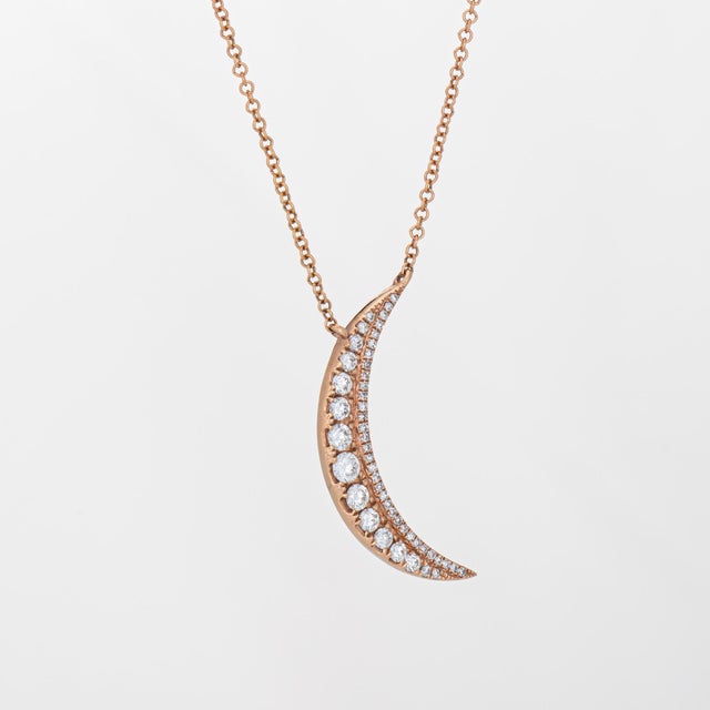 Stylish diamond crescent moon necklace crafted in 14 karat rose gold. Diamonds total an estimated 0.30 carats (estimated...