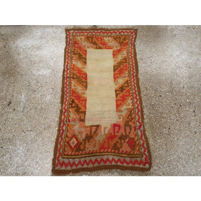 A wool pile with symmetric knots on a wool foundation. This piece is a Western adaptation of a traditional Caucasian...