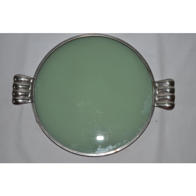 This item is an antique cake stand or serving tray.