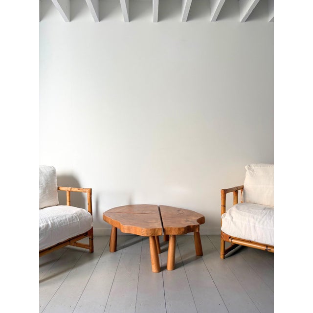 A pair of mid century rattan armchairs with a striking geometric lines and boxy cubic form, in the manner of vivai del...